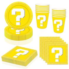 a bunch of yellow paper plates with question mark on them