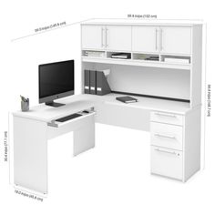 a computer desk with a monitor and keyboard