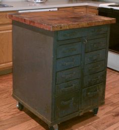 a kitchen island made out of metal and wood