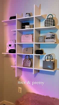 a white shelf filled with purses and handbags on it's sides next to a pink fur rug