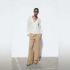 Collared, Deep V-Neck Linen Long Sleeve Relaxed V-neck Blouse For Day Out, Casual Linen V-neck Shirt, Neutral V-neck Top For Day Out, Beige V-neck Shirt For Work, Relaxed Spring Workwear Blouse, Relaxed Blouse For Spring Workwear, Chic Linen Fall Shirt, Classic Neutral Blouse For Summer, Casual Neutral Shirt For Work