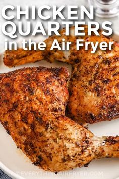 chicken quarters in the air fryer on a white plate with text overlay that reads chicken quarters in the air fryer