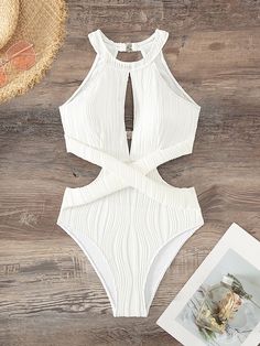 Elevate your poolside style with our elegant Cut Out Waist Halter One Piece Swimsuit. This plain yet sophisticated swimsuit features a high neck and chic cut-out waist, complemented by a backless design and ruched details. The bikini bottom type and wireless bra provide a comfortable fit, while the high-stretch fabric and removable padding ensure customizable support. Perfect for lounging in style, this swimsuit is recommended for poolside use and is not water-resistant. 95% Polyester, 5% Elasta Poolside Style, Backless One Piece Swimsuit, Poolside Fashion, Trendy Swimsuits, Swimwear High Waisted, Swimsuit Sale, Swimsuit Design, Halter One Piece Swimsuit, White Swimsuit