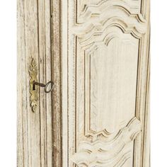 an old white wooden door with a handle on it's left side and the bottom panel