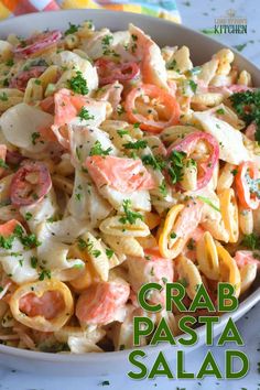 a bowl filled with pasta and vegetables on top of a table