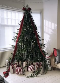 a decorated christmas tree in a living room