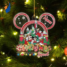 a mickey mouse ornament hanging from a christmas tree