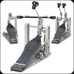 two pedals and one pedal stand with wheels on each side, for musical instruments