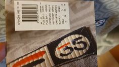 a close up of a label on a shirt that has the number 55 printed on it