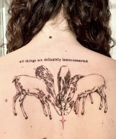 the back of a woman's upper body with two horses on it and an inscription that reads, all things are delicately interconnecteded