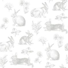 a white wallpaper with rabbits and flowers on it's back drop down to the side