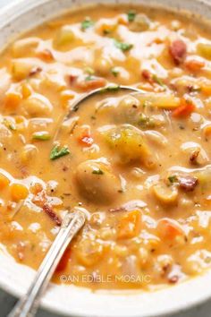 a white bowl filled with soup on top of a table