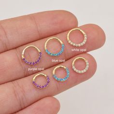 Metal: 14k solid gold, Available Gold color: Yellow gold  Guaranteed Authentic 14k Gold, Not Plated or Filled Stone: Opal 1.2mm   White Opal, Blue Opal, Purple Opal Thickness: 1.2mm(16G) Inner diameter:6mm&7mm&8mm&9mm&10mm Stamp:14k This item is for ONE piece, NOT a pair   SHIPPING ADDRESS ●All the orders will ship to the supplied address through your Etsy Order, Please leave your phone number,will give to carrier for safe deliver. ●We will not send and replacement parcels due to incomplete or inaccurate address.  PACKING ●Can be Gift packed including Jewelry Box, Ribbon or Bow and your personlized message.  RETURN/REFUND ● We gladly accept refunds on undamaged goods up to 7 days after delivery in the original packaging. ● Please contact me for asking the return address.  CUSTOMS & DUTY ●B Daith Earrings Blue, Opal Septum Ring, Opal Septum, Conch Hoop, Cartilage Ring, Helix Earrings, Nose Hoop, White Opal, Tragus