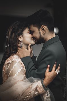 a man and woman embracing each other in front of a black background with the words love written on it