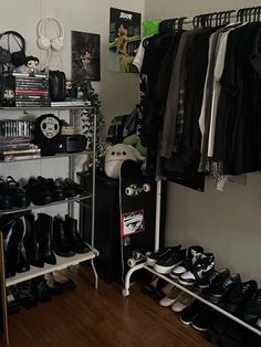 a room filled with lots of black shoes and clothes on shelves next to each other