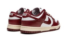 The Women’s Nike Dunk Low PRM “Team Red” is a women’s-exclusive colorway of the classic basketball shoe with an aged vibe.  The “Team Red” Dunk Low gives the popular and iconic silhouette a timeless appearance with a white leather upper contrasted with Team Red leather overlays and Swoosh branding on the sides.  “Nike” branding is found on both the tongue tag and heel.  A pre-aged midsole gives the shoe a decidedly vintage look.  Release date: April 21, 2023 Nike Dunk Low Red, Sneaker Displays, Womens Red Shoes, Sneakers Box, Nike Branding, Timeless Shoes, School Fit, Team Red