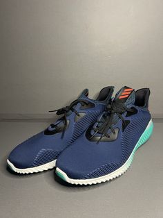 Elevate your training game with these stylish and comfortable cross-training shoes from adidas. The 2016 Alphabounce model boasts a mineral blue, red, green, and white colorway with infrared detailing that will make you stand out in any workout ensemble. These shoes are designed with a medium width and a US shoe size of 15, making them an ideal fit for any active man. The adidas Alphabounce model is known for its lightweight feel and superior support, making it perfect for high-intensity workouts. These shoes are equipped with a cross-training design that targets all major muscle groups, making them an excellent choice for any athletic activity. With their sleek style and advanced technology, the adidas Alphabounce shoes are a must-have for any fitness enthusiast. Blue Breathable Mid-top Running Shoes, Fade-resistant Blue Running Shoes For Outdoor, Adidas Blue Athleisure Running Shoes, Adidas Mnd Blue, Blue Athletic Fit Fade-resistant Running Shoes, Training Design, Major Muscles, Cross Training Shoes, High Intensity Workout