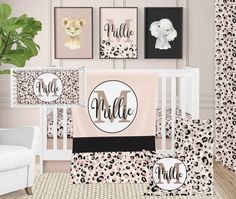 a baby crib bedding set with animal prints and monogrammed name on it