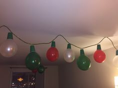 christmas lights hanging from the ceiling in a room