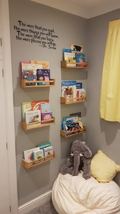 a child's room with bookshelves and stuffed animals on the shelves in it