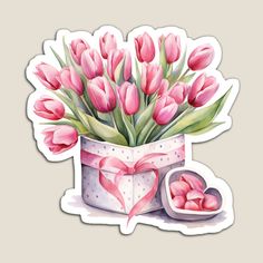 a bouquet of pink tulips in a gift box with a heart shaped bow