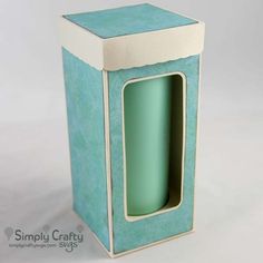 a blue and white box that has a handle on the top with a window in it