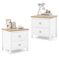 two white nightstands side by side with pictures on them