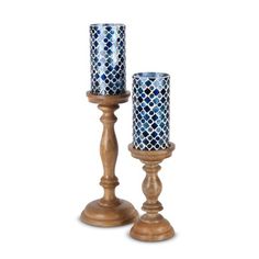 two wooden candlesticks sitting next to each other