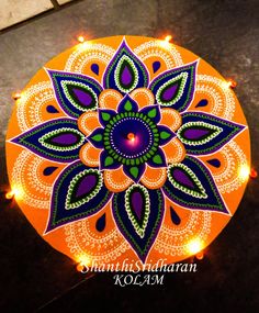 an orange and purple decorated rangdi with lights