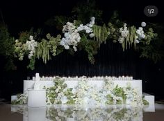 a table with flowers and candles on it