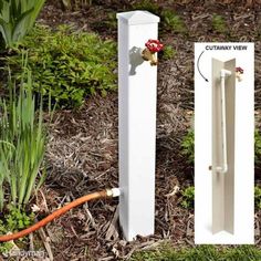 a white post with an orange hose connected to it next to some grass and flowers