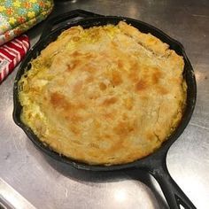 a pie in a cast iron skillet sitting on top of a stove