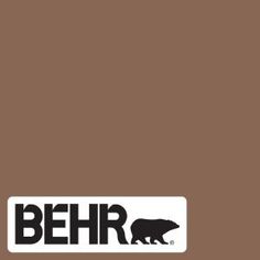 the logo for behr is shown in black and white on a brown background with an image of a bear