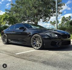 a black car parked in a parking lot