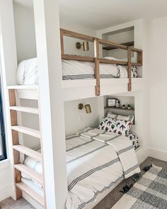 a bedroom with bunk beds and white walls