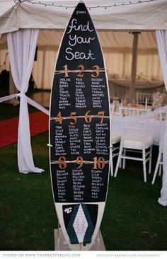 a surfboard is set up for a wedding reception