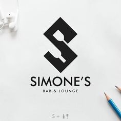 the logo for simone's bar and lounge is displayed on a table with headphones