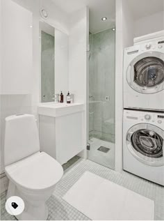 a washer and dryer in a white bathroom