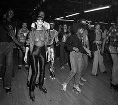 black and white photograph of people dancing on a dance floor in an old fashion club