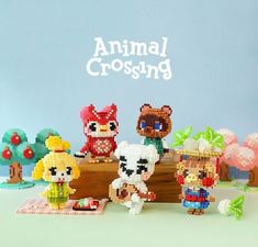 an animal crossing game is displayed on a table with other animals and toys around it