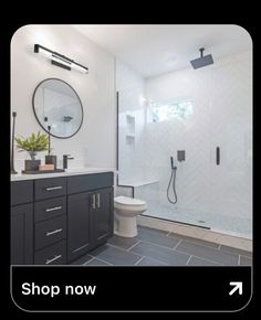 a bathroom with black and white tile flooring next to a walk - in shower