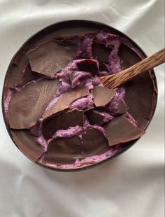 a bowl filled with chocolate and purple food