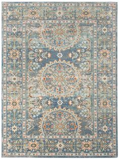 a blue and beige rug with an ornate design