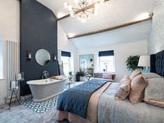 a bedroom with a large bed and bathtub in it