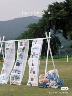 an advertisement for fancy moment with clothes hanging on a line and flowers in the foreground