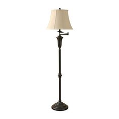 a floor lamp with a white shade on it's base and a black metal pole