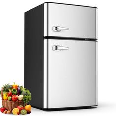 two refrigerators side by side next to a basket of fruit and vegetables