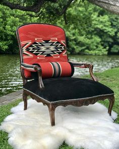 an old chair is sitting in the grass