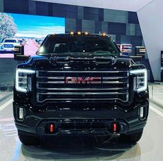 the gmc truck is on display at an auto show