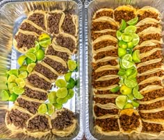 two trays filled with different types of food on top of each other and topped with toppings